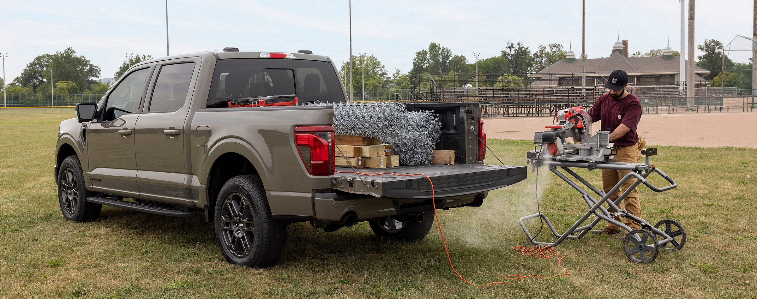 Man working beside the Carhartt branded F150