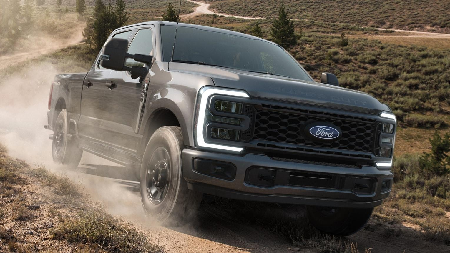 2027 Ford Super Duty driving on a dirt road